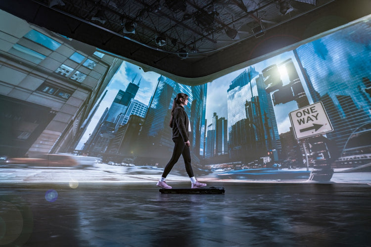 Woman walking through a city block with Xero Shoes Pacer Lite