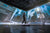 Woman walking through a city block with Xero Shoes Pacer Lite