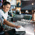 A bartender cleaning the bar