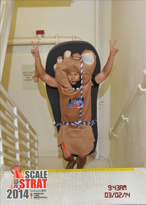 Khanh scaling the Stratosphere Hotel in his barefoot sandals by Xero Shoes