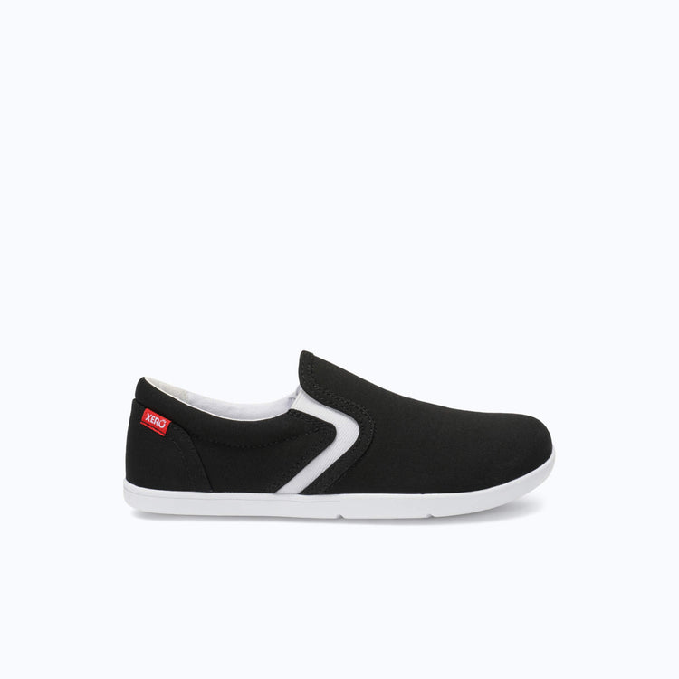 Xero Shoes Dillon Canvas Slip-On Big Kids Shoe in Black with Toe Facing Right