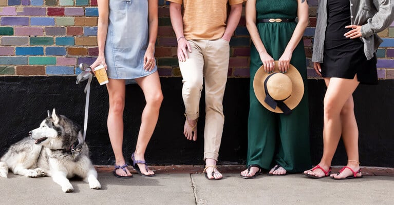 Four people wearing sandals