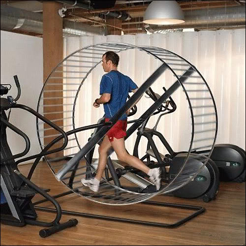 Man running on hamster wheel