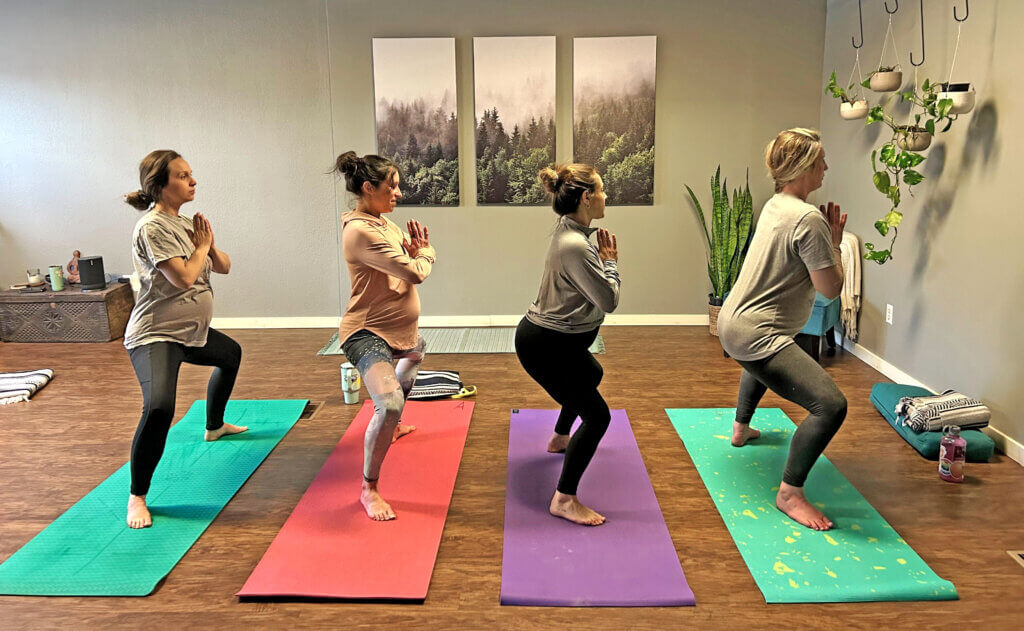 Women practicing prenatal yoga 