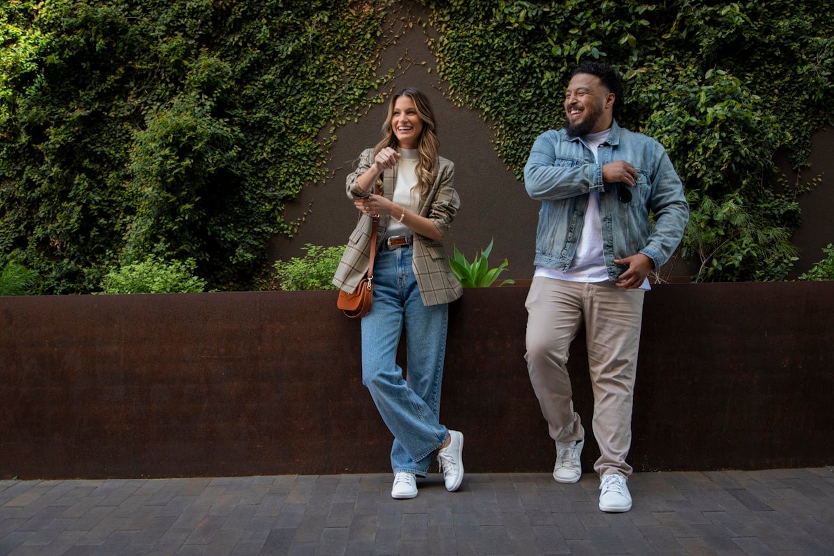 A stylish couple on the sidewalk in their Dillon Leather shoes.